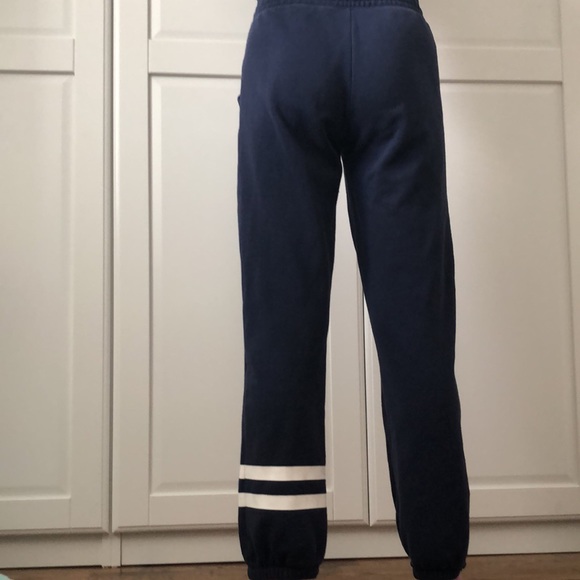 These are navy blue loose fitting sweatpants. - Picture 3 of 4